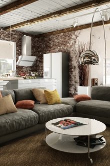 Μοντέρνος γκρίζος καναπές σε ένα μοντέρνο σαλόνι-κουζίνα