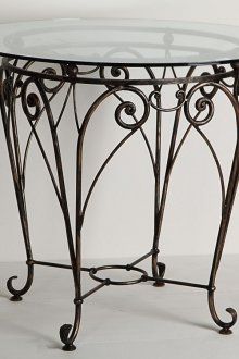 Στρογγυλό σφυρήλατο τραπέζι με γυάλινη κορυφή