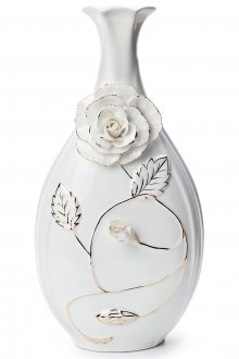 Λευκό αγγείο πορσελάνης με λουλούδι