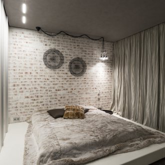 Τούβλο τοίχο στο υπνοδωμάτιο σοφίτα