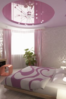 Pink stretch ceiling in the bedroom
