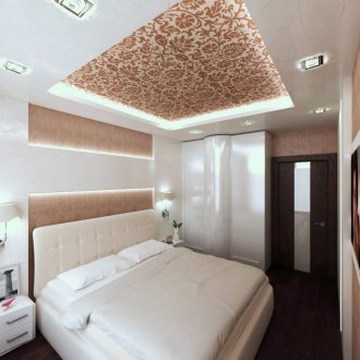 Stretch ceiling with a pattern in the bedroom
