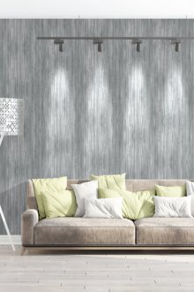 Γκρίζο καθιστικό με πράσινα μαξιλάρια στον καναπέ