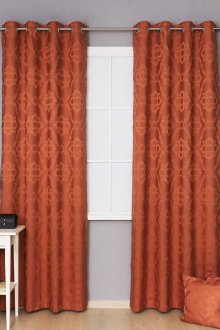 Πορτοκαλί κουρτίνες σε ροδέλες με μοτίβο