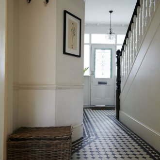 Entrance hall in a private house with black and white tiles