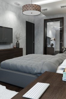 Μαύρη πόρτα και σκούρο παρκέ στο υπνοδωμάτιο