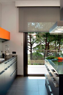 Black and orange high-tech kitchen.