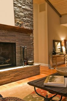 Τζάκι διακοσμητικό με γκρι πέτρα στο σαλόνι