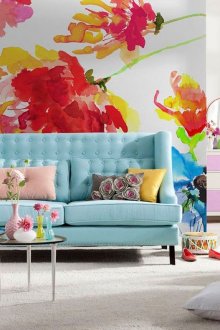 Large bright flowers in the design of wallpaper in the living room